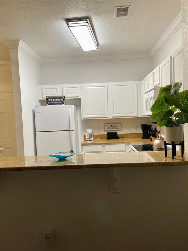 8010 Tuscany Way Unit 3102, Davenport, FL 33896 - kitchen with white appliances, ornamental molding, white cabinets, light stone counters, and a textured ceiling