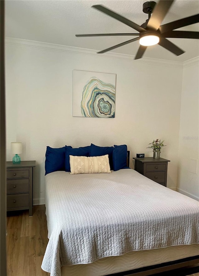 8010 Tuscany Way Unit 3102, Davenport, FL 33896 - bedroom featuring crown molding, wood finished floors, and ceiling fan