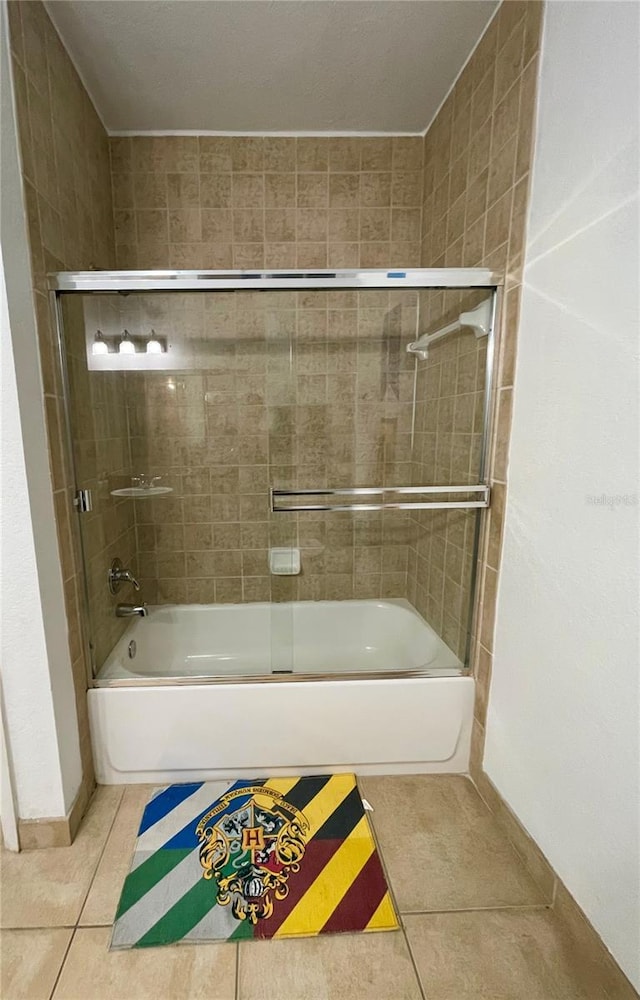 8010 Tuscany Way Unit 3102, Davenport, FL 33896 - bathroom with tile patterned floors and combined bath / shower with glass door