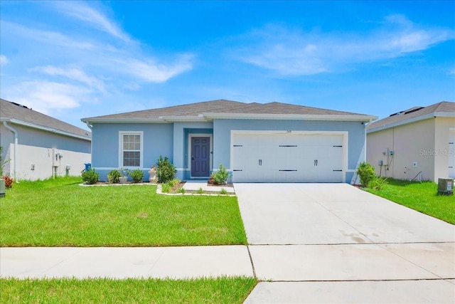 145 Piave St, Haines City, FL 33844 - ranch-style house with a garage, stucco siding, driveway, and a front yard