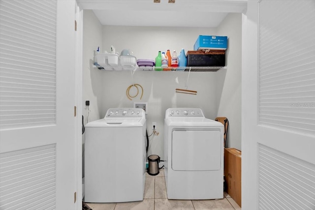 145 Piave St, Haines City, FL 33844 - washroom featuring separate washer and dryer and tile patterned floors