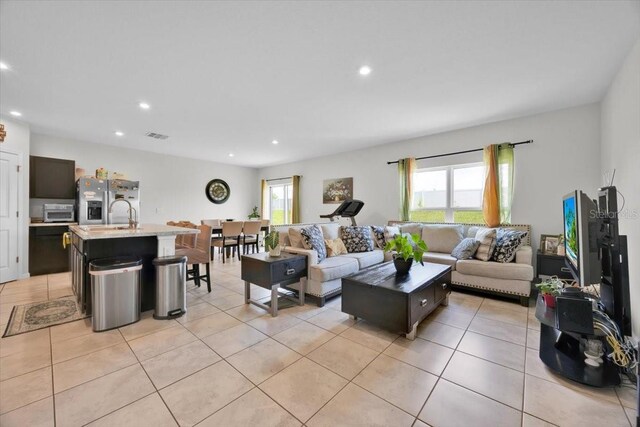 145 Piave St, Haines City, FL 33844 - living area with recessed lighting and light tile patterned floors