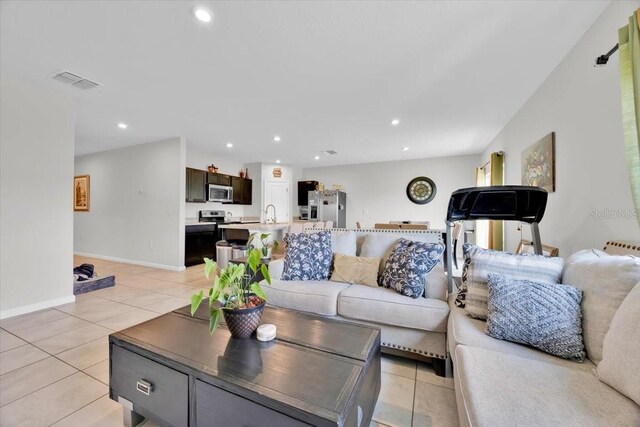 145 Piave St, Haines City, FL 33844 - living room with light tile patterned floors and recessed lighting