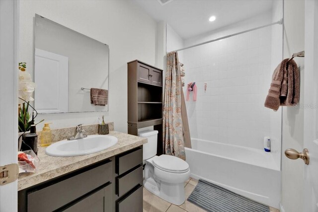 145 Piave St, Haines City, FL 33844 - full bath with vanity, shower / bath combo, and tile patterned flooring