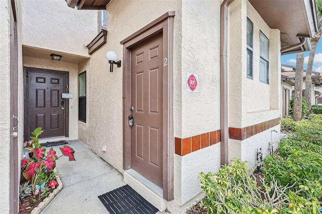 3118 S Semoran Blvd Unit 2, Orlando, FL 32822 - doorway to property with stucco siding