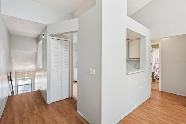 3118 S Semoran Blvd Unit 2, Orlando, FL 32822 - hall featuring wood finished floors and an upstairs landing