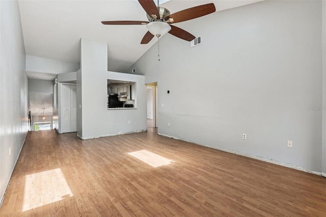 3118 S Semoran Blvd Unit 2, Orlando, FL 32822 - unfurnished living room featuring ceiling fan, wood finished floors, and high vaulted ceiling