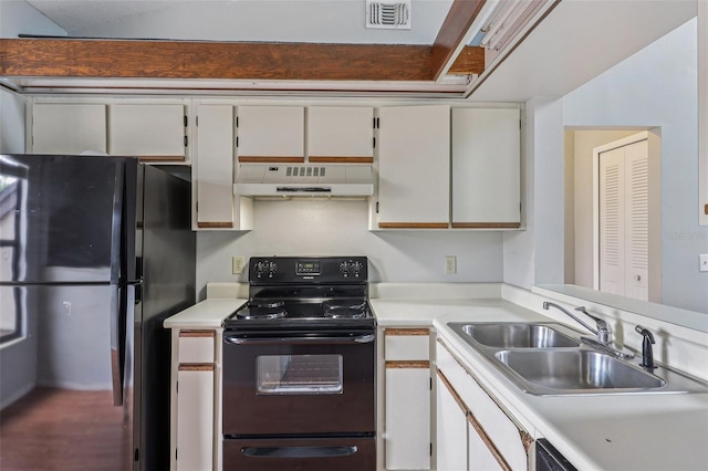3118 S Semoran Blvd Unit 2, Orlando, FL 32822 - kitchen featuring under cabinet range hood, black appliances, and light countertops
