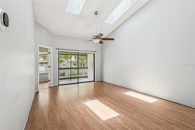 3118 S Semoran Blvd Unit 2, Orlando, FL 32822 - spare room featuring high vaulted ceiling, a skylight, wood finished floors, and ceiling fan