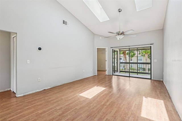 3118 S Semoran Blvd Unit 2, Orlando, FL 32822 - empty room featuring high vaulted ceiling, light wood finished floors, a skylight, and a ceiling fan