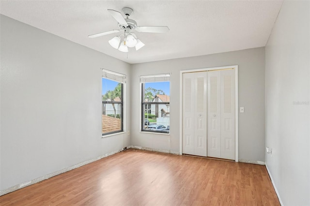 3118 S Semoran Blvd Unit 2, Orlando, FL 32822 - unfurnished bedroom featuring wood finished floors, a closet, and a ceiling fan