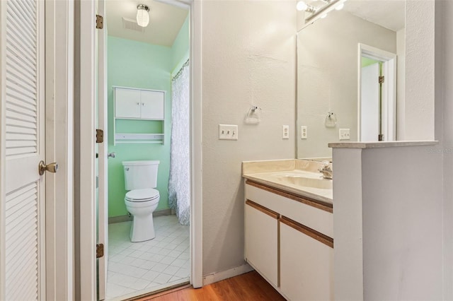 3118 S Semoran Blvd Unit 2, Orlando, FL 32822 - bathroom featuring vanity, wood finished floors, and a closet