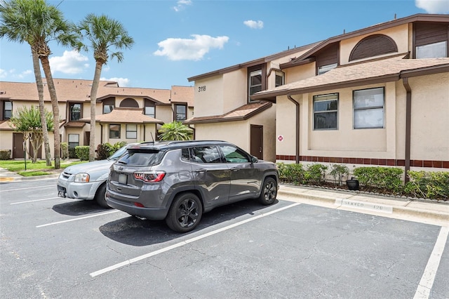 3118 S Semoran Blvd Unit 2, Orlando, FL 32822 - view of front of house featuring uncovered parking and stucco siding
