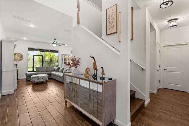 922 Grazie Loop, Davenport, FL 33837 - foyer with stairs, wood finished floors, a ceiling fan, and recessed lighting
