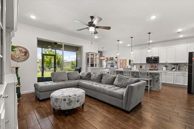 922 Grazie Loop, Davenport, FL 33837 - living area featuring a ceiling fan, dark wood-style floors, and recessed lighting