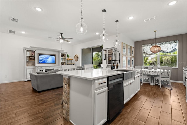 922 Grazie Loop, Davenport, FL 33837 - kitchen featuring dishwasher, dark wood-style floors, light countertops, recessed lighting, and a ceiling fan