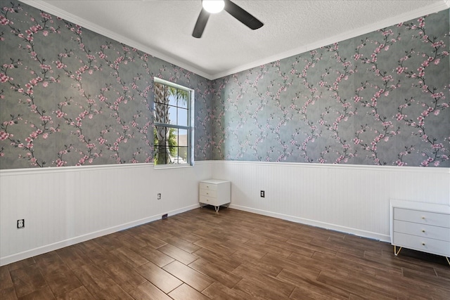 922 Grazie Loop, Davenport, FL 33837 - unfurnished room featuring wood finished floors, a wainscoted wall, a ceiling fan, crown molding, and a textured ceiling