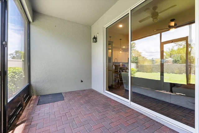 922 Grazie Loop, Davenport, FL 33837 - unfurnished sunroom featuring a ceiling fan