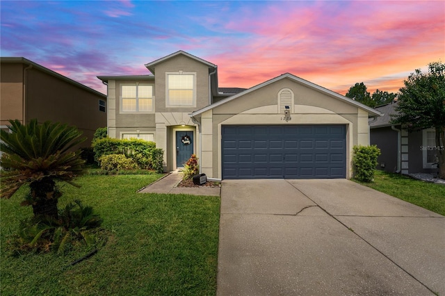 1224 Blackwater Pond Dr, Orlando, FL 32828 - traditional home featuring stucco siding, concrete driveway, an attached garage, and a front yard