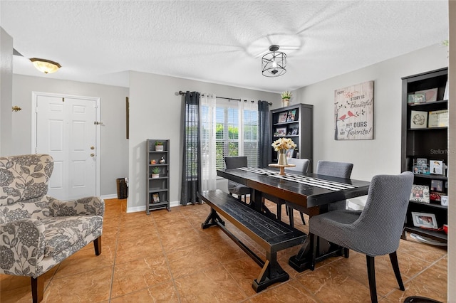 1224 Blackwater Pond Dr, Orlando, FL 32828 - dining space featuring a textured ceiling and light tile patterned floors