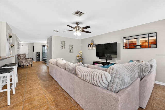1224 Blackwater Pond Dr, Orlando, FL 32828 - living area with ceiling fan and baseboards