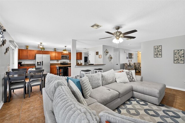 1224 Blackwater Pond Dr, Orlando, FL 32828 - living area with ceiling fan and baseboards