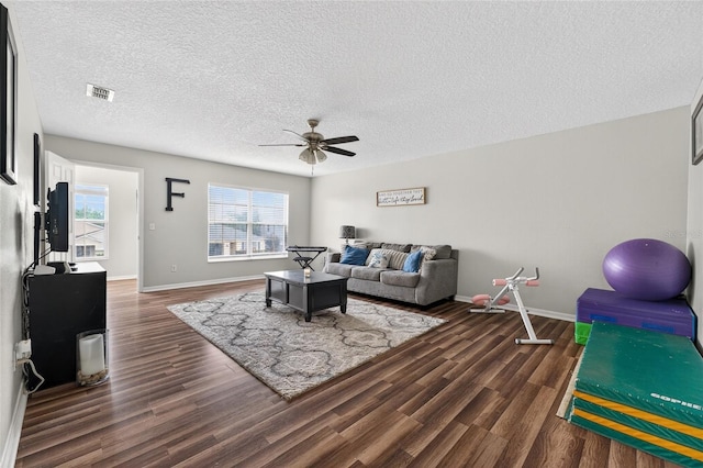 1224 Blackwater Pond Dr, Orlando, FL 32828 - living room with ceiling fan, dark wood-type flooring, and a textured ceiling