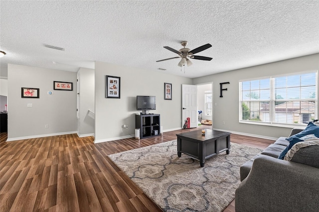 1224 Blackwater Pond Dr, Orlando, FL 32828 - living room with wood finished floors, ceiling fan, and a textured ceiling
