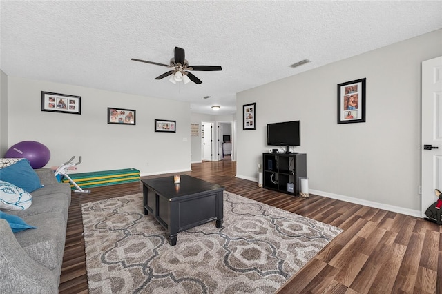 1224 Blackwater Pond Dr, Orlando, FL 32828 - living room with a ceiling fan, wood finished floors, and a textured ceiling