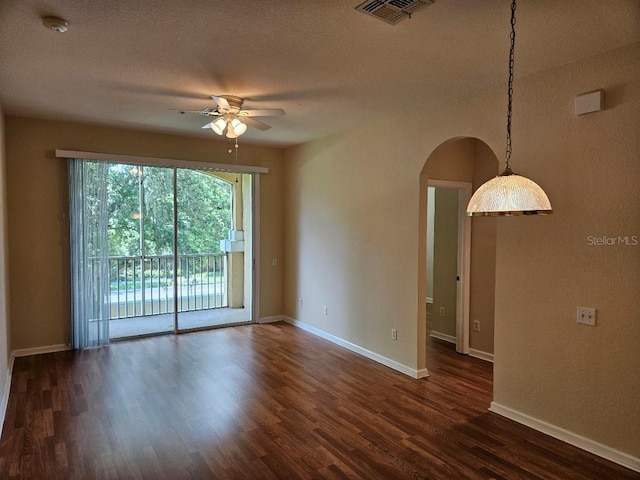 6214 Stevenson Dr Unit 208, Orlando, FL 32835 - unfurnished room with ceiling fan, arched walkways, dark wood-style flooring, and a smoke detector
