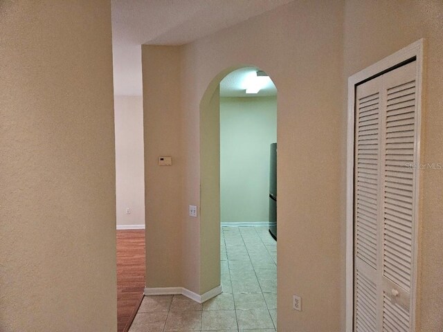 6214 Stevenson Dr Unit 208, Orlando, FL 32835 - corridor with light tile patterned flooring and arched walkways