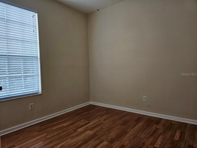 6214 Stevenson Dr Unit 208, Orlando, FL 32835 - unfurnished room featuring dark wood-style floors and baseboards