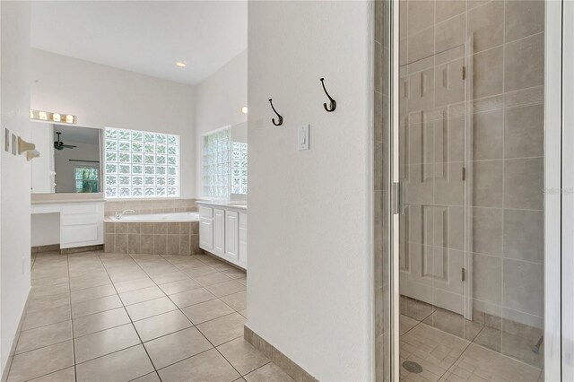 19554 Spring Oak Dr, Eustis, FL 32736 - bathroom with vanity, tile patterned floors, a garden tub, and a shower stall