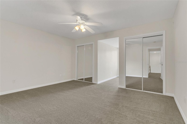 19554 Spring Oak Dr, Eustis, FL 32736 - unfurnished bedroom with two closets, carpet flooring, and a ceiling fan