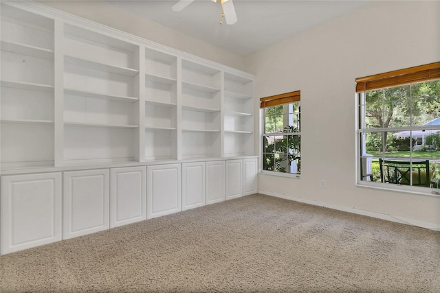 19554 Spring Oak Dr, Eustis, FL 32736 - empty room featuring light carpet, ceiling fan, and built in features