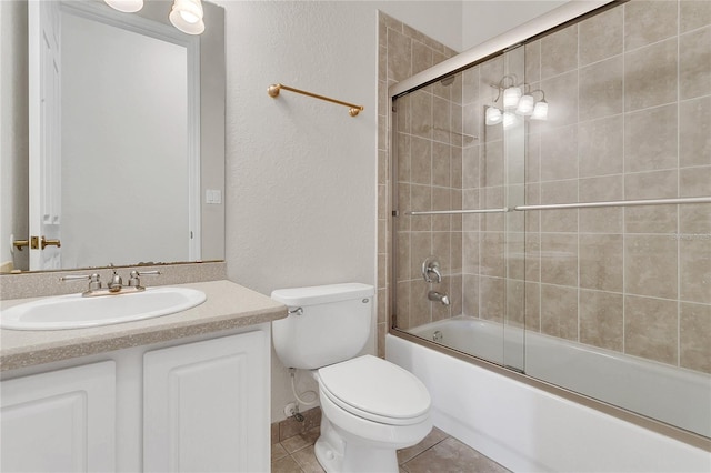 19554 Spring Oak Dr, Eustis, FL 32736 - bathroom featuring a textured wall, vanity, enclosed tub / shower combo, and tile patterned flooring