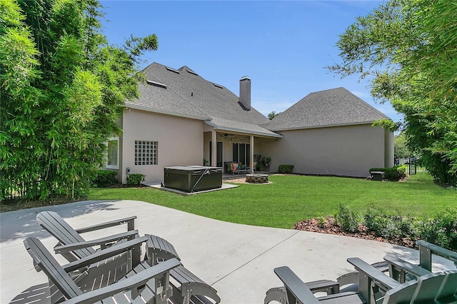 19554 Spring Oak Dr, Eustis, FL 32736 - rear view of property with a hot tub, a patio, a lawn, a ceiling fan, and roof with shingles