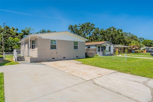 3850 11th Ave S, Saint Petersburg, FL 33711 - view of front facade with crawl space, concrete driveway, and brick siding