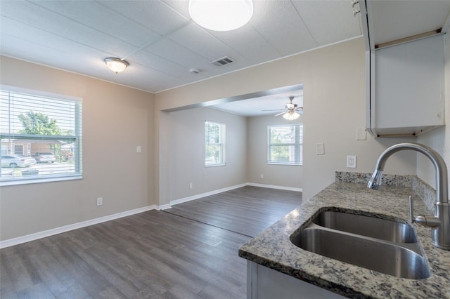 3850 11th Ave S, Saint Petersburg, FL 33711 - kitchen featuring wood finished floors, light stone counters, and a ceiling fan