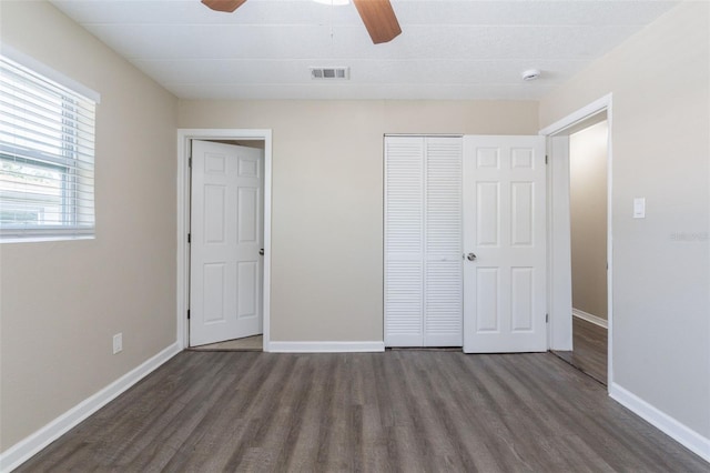 3850 11th Ave S, Saint Petersburg, FL 33711 - unfurnished bedroom with wood finished floors, a closet, and a ceiling fan