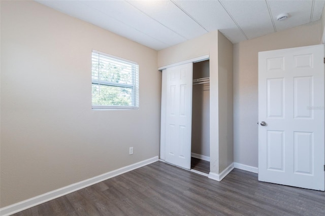 3850 11th Ave S, Saint Petersburg, FL 33711 - unfurnished bedroom with dark wood finished floors and a closet