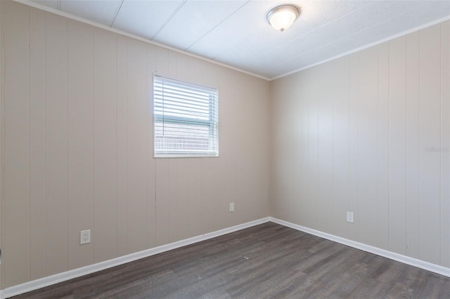3850 11th Ave S, Saint Petersburg, FL 33711 - empty room featuring dark wood-style flooring and baseboards