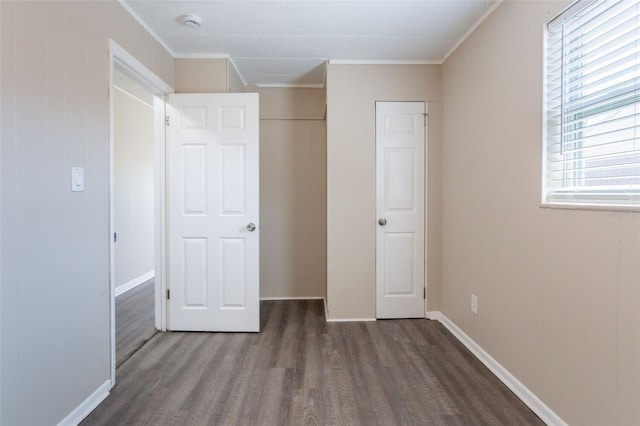3850 11th Ave S, Saint Petersburg, FL 33711 - unfurnished bedroom with wood finished floors, ornamental molding, and a closet