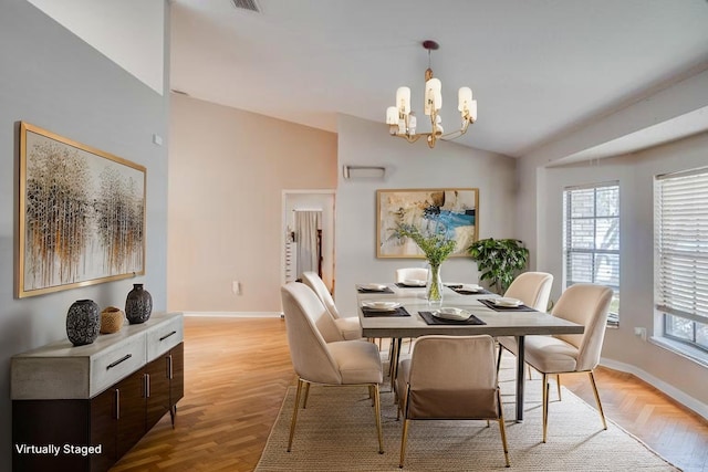 2406 Sweetwater Blvd, Saint Cloud, FL 34772 - dining space featuring lofted ceiling, plenty of natural light, a chandelier, and light wood-style floors