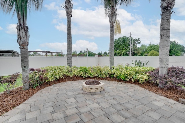 2406 Sweetwater Blvd, Saint Cloud, FL 34772 - fenced backyard featuring a patio area and a fire pit
