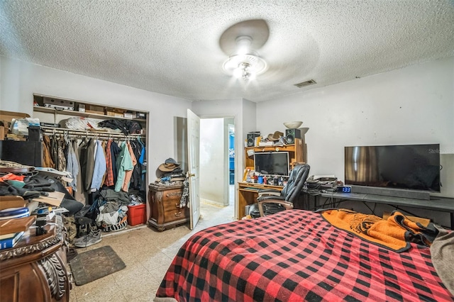 6401 Fortune Ln, Apopka, FL 32712 - bedroom featuring a closet, a textured ceiling, and tile patterned floors