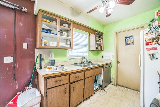 6401 Fortune Ln, Apopka, FL 32712 - kitchen with freestanding refrigerator, stainless steel dishwasher, light floors, light countertops, and a ceiling fan