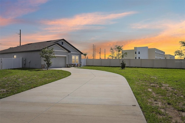 785 Orchid Grove Blvd, Davenport, FL 33837 - view of home's exterior featuring concrete driveway, a garage, and stucco siding