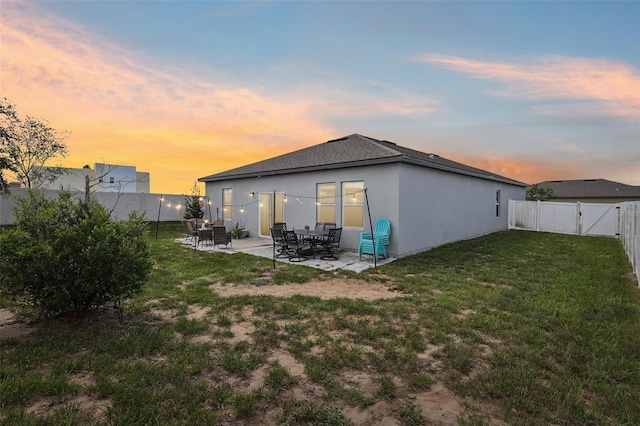 785 Orchid Grove Blvd, Davenport, FL 33837 - back of house featuring a patio area, a fenced backyard, stucco siding, a gate, and roof with shingles