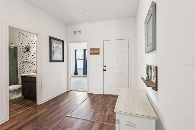 785 Orchid Grove Blvd, Davenport, FL 33837 - entrance foyer featuring dark wood-style floors and baseboards
